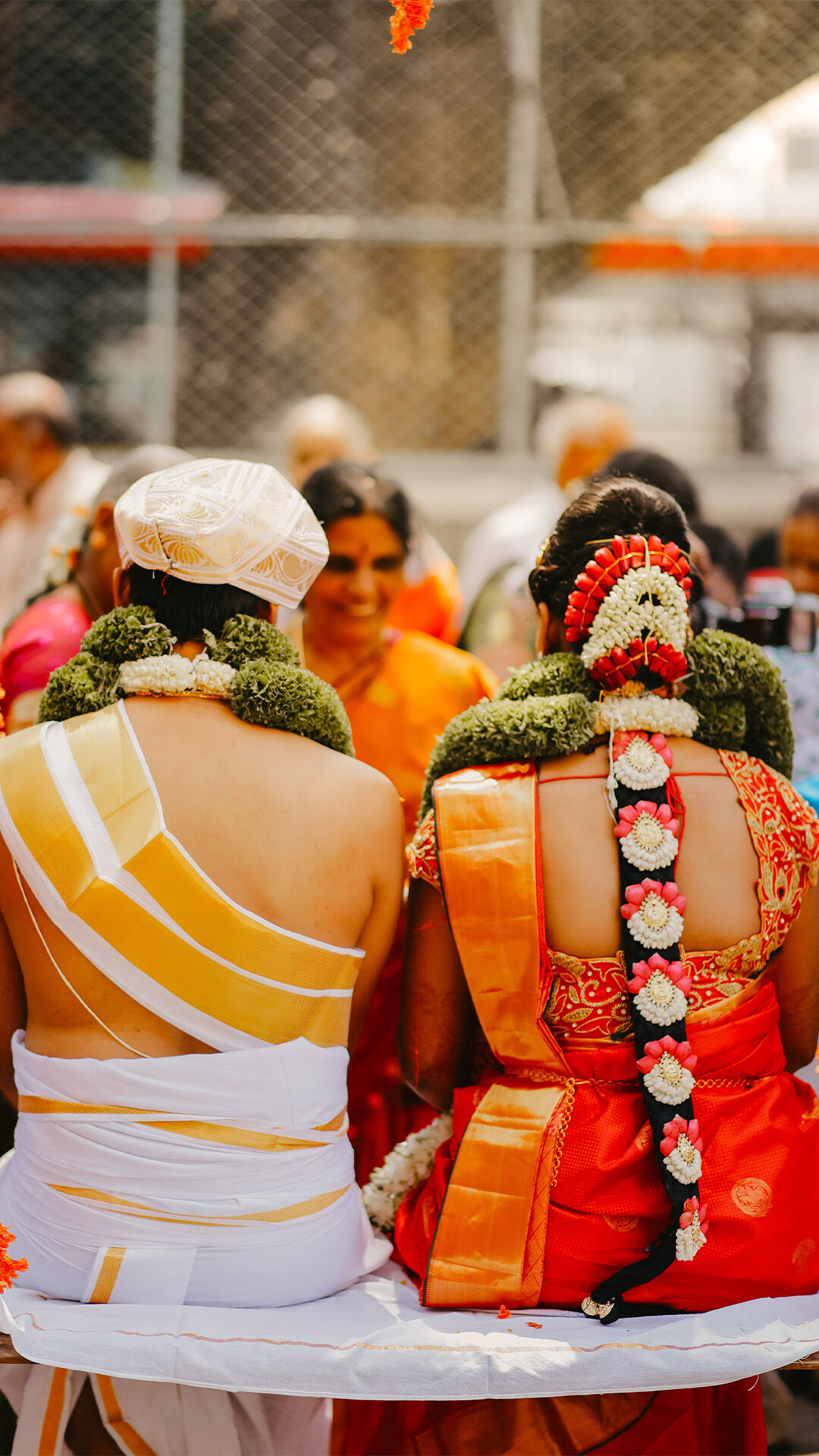 North Indian bride and groom elegantly dressed in traditional wedding attire, celebrating their cultural wedding rituals.
